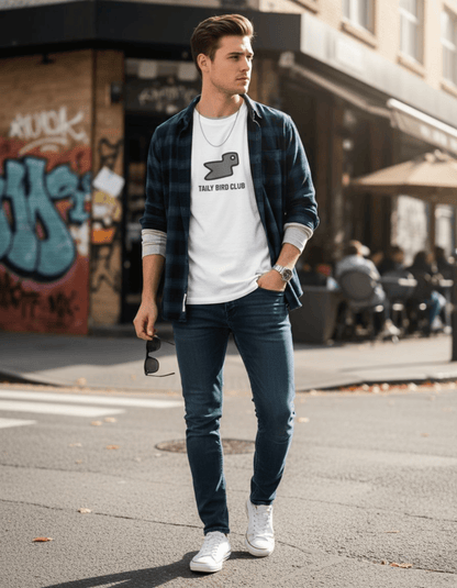 Young man wearing Taily Bird Club Streetwear Boxy T-Shirt in white with grey bird graphic, paired with jeans.