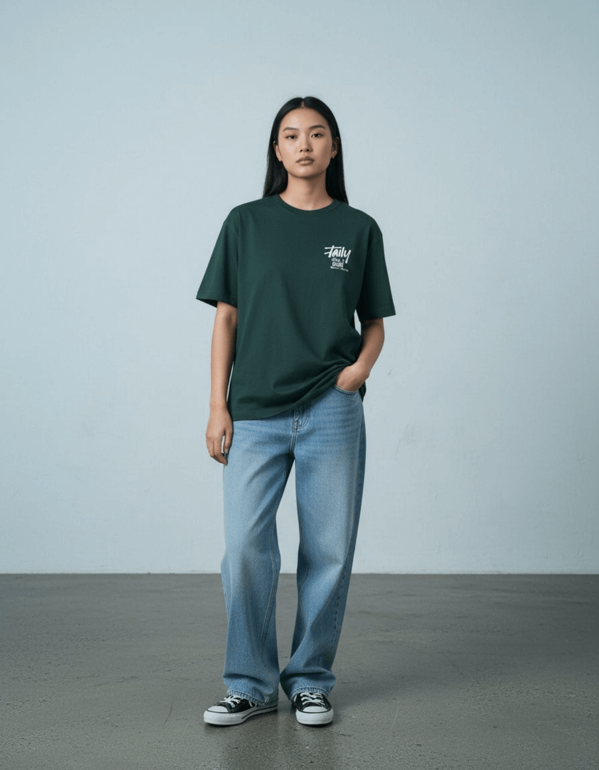 Model wearing Taily Feel It Real boxy tee in forest green, showcasing streetwear boxy t-shirt style with relaxed fit.