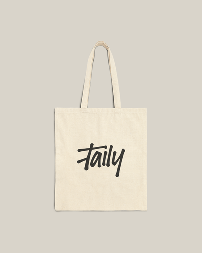 Taily Bird Bold Canvas Tote Bag showcasing natural fabric with a bold logo, perfect for everyday use.