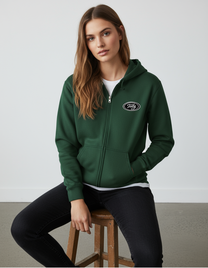 Model wearing Taily Zip Hoodie in forest green with embroidered logo, showcasing classic streetwear style.