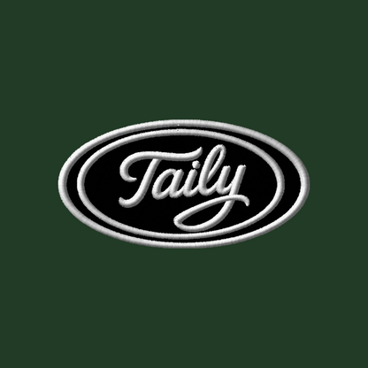 Taily logo embroidered patch on a classic zip hoodie in forest green, showcasing minimalistic streetwear style.
