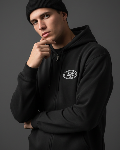 Model wearing Taily Zip Hoodie in black, showcasing classic embroidered streetwear style.