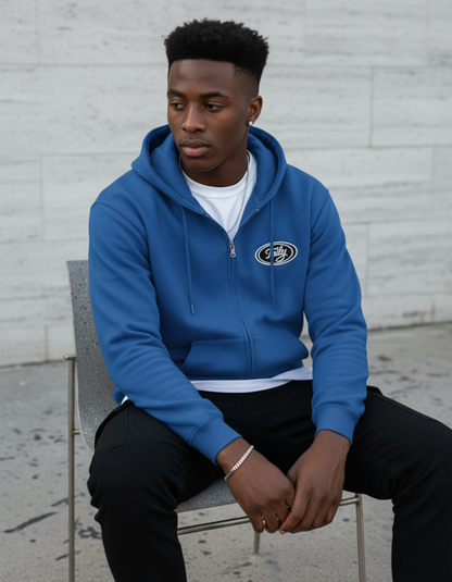Taily Zip Hoodie – Classic Embroidered Streetwear in Royal, worn by a model sitting casually.