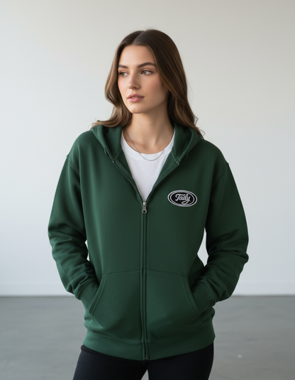 Taily Zip Hoodie in forest green, showcasing embroidered logo and relaxed fit on model.