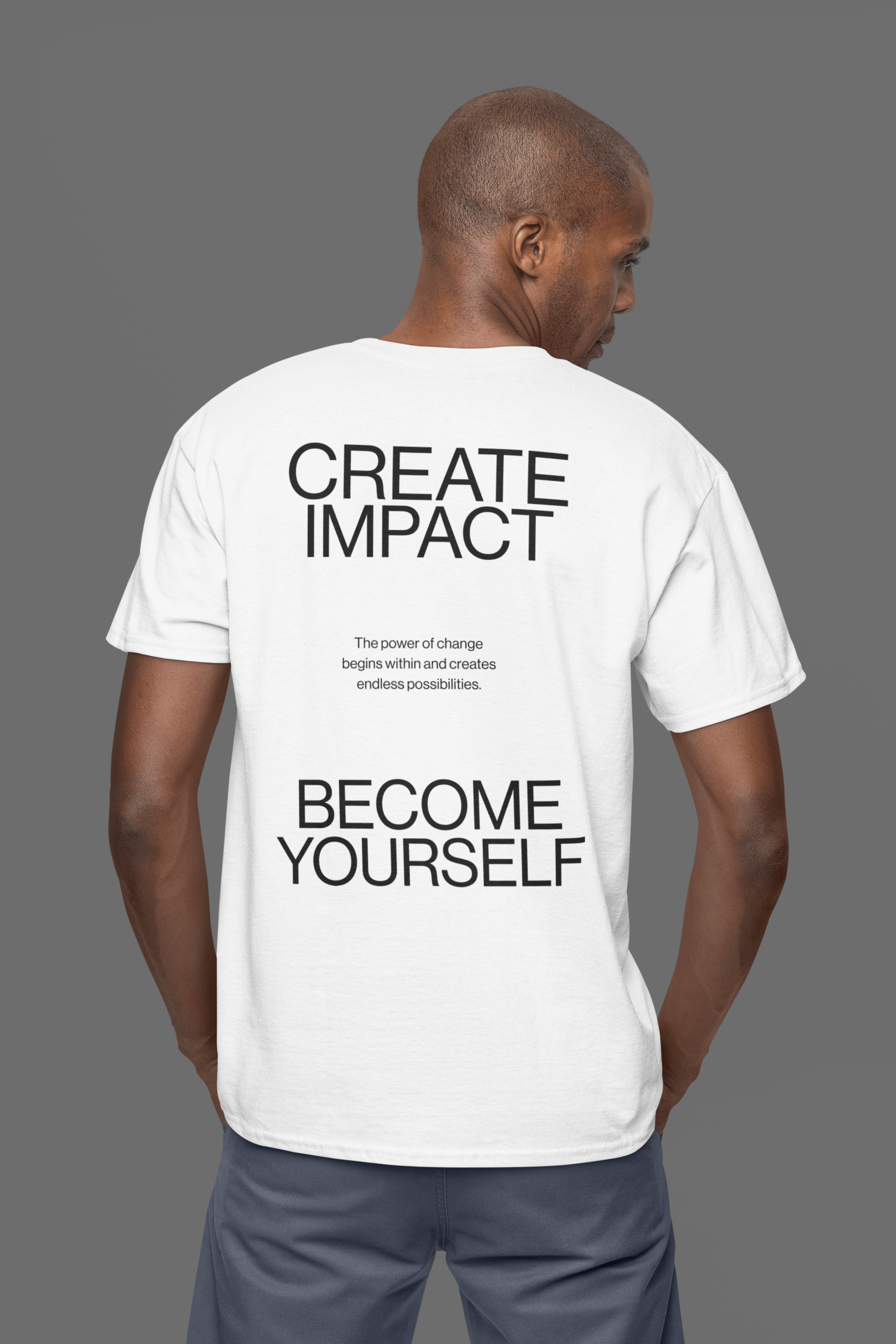 Back view of the Create Impact Oversized Tee featuring motivational text and clean typography.