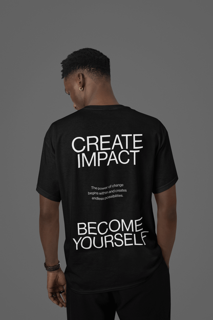Black oversized tee with uplifting message 'Create Impact' and 'Become Yourself' on the back, showcasing personal transformation.