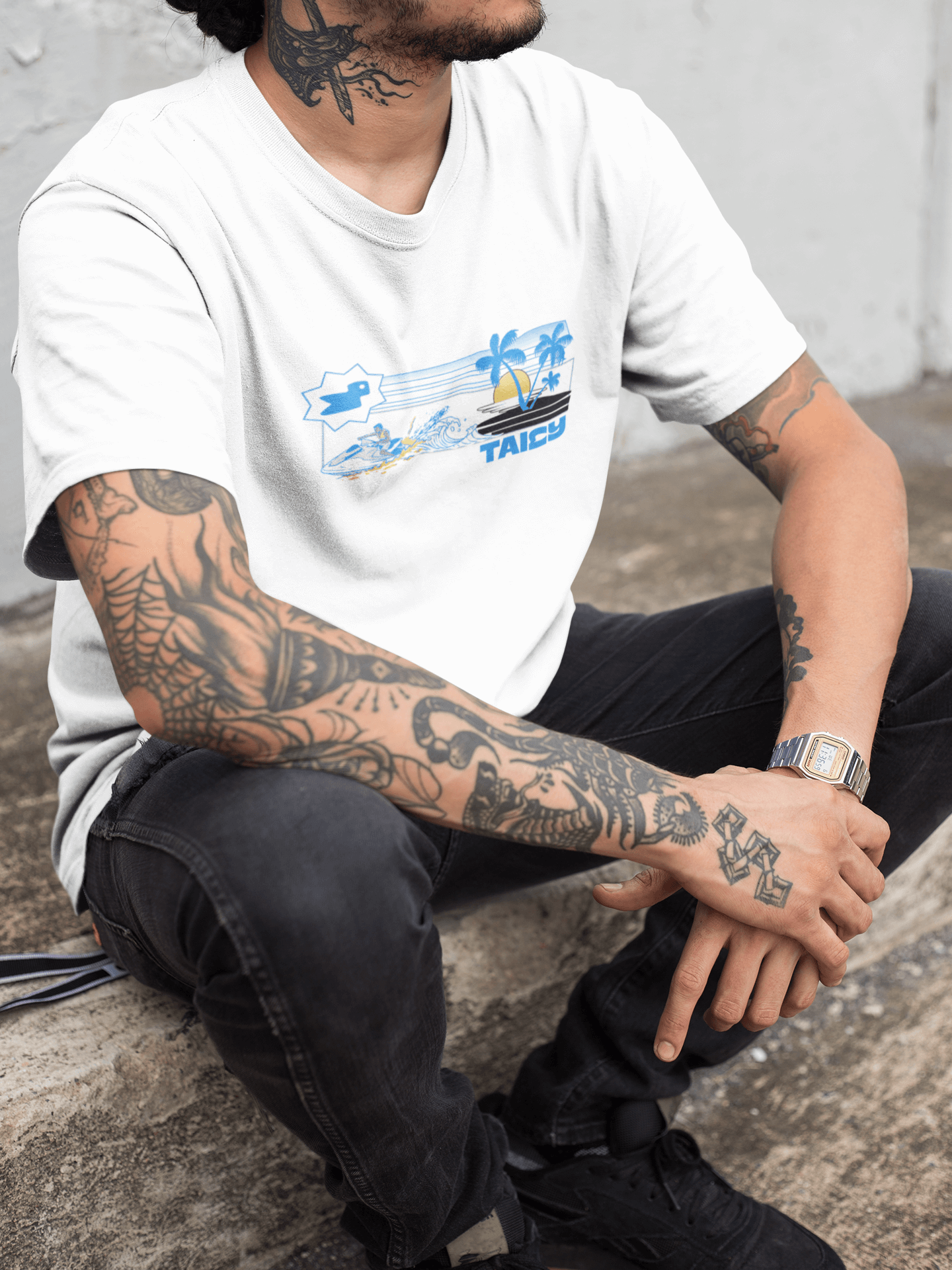 Model wearing Taily Jet Splash white graphic t-shirt featuring jet ski and island print, showcasing streetwear style.