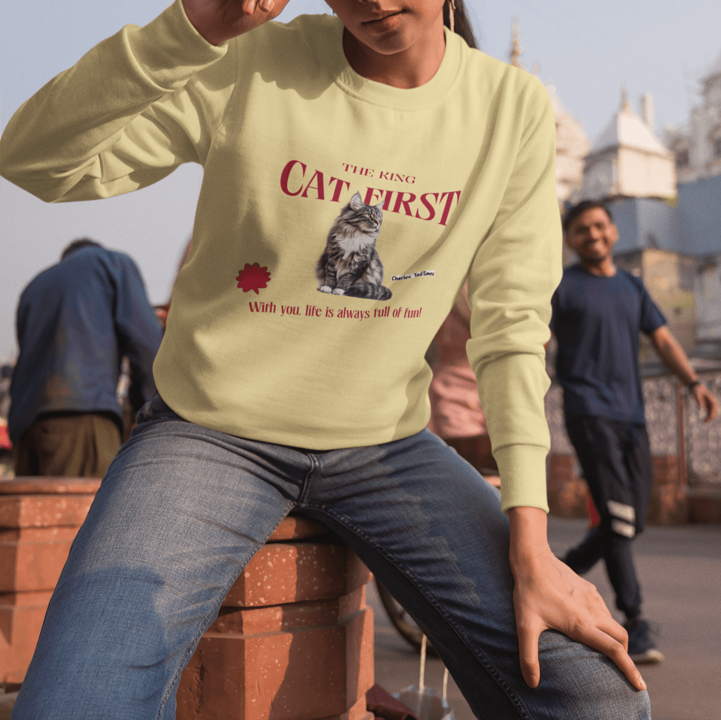 Yellow sweatshirt with a Maine Coon cat graphic, red 