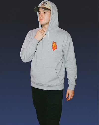 Model wearing Good Fries Only Retro French Fries Hoodie – Sport Grey with a sporty pose.